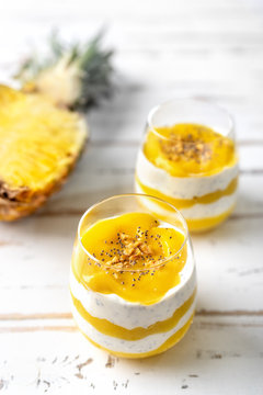 Mango pineapple smoothie with yogurt in two glasses