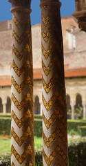 Inlaid marble mosaics on slender columns of the cloister