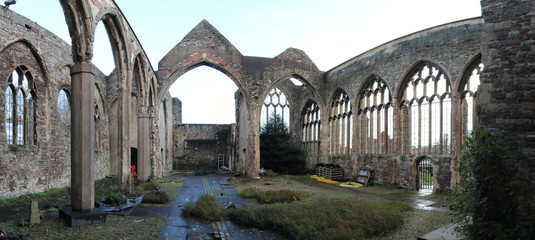 The interior of the abandoned rumbled Saint Peter's Church in the Castle Park, with pointed arch Gothic windows, in Bristol, United Kingdom
