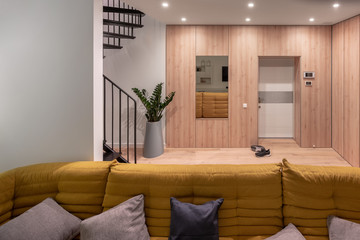 Stylish interior in modern style with light walls and luminous lamps