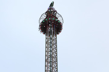 A steel made drop tower atrraction in the Gorsedd Gardens amusement park in Bristol, United Kingdom, in a cloudy winter day