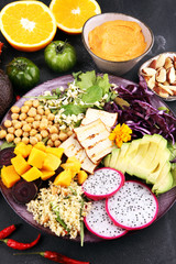 grilled tofu and dragon fruit buddha bowl with vegetable and humus