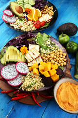 grilled tofu and dragon fruit buddha bowl with vegetable and humus