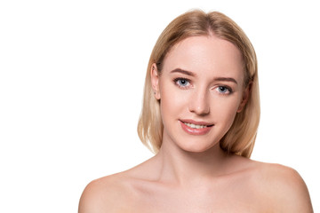 Beautiful face of young blond woman with clean fresh skin and natural make up on white background.