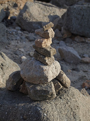 stack of stones (cairn) at Morro Rock, California, USA