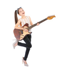 Obraz premium Little cheerful girl in mother's shoes playing guitar, isolated on white