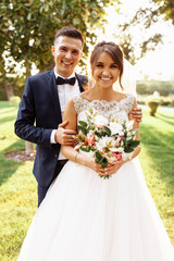 portrait of the bride and groom in nature, beautiful couple in love