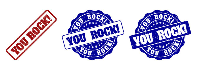 YOU ROCK! scratched stamp seals in red and blue colors. Vector YOU ROCK! labels with grainy texture. Graphic elements are rounded rectangles, rosettes, circles and text captions.