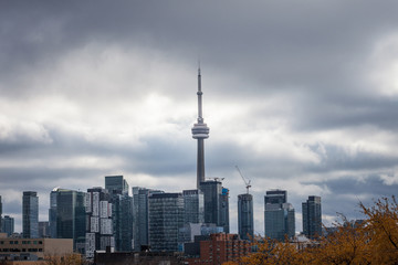 Fototapeta premium Toronto skyline, with the iconic towers and buildings of the Downtown and the CBD business skyscrapers taken from afar. Tonroto is the main city of Ontario and Canada, and an American finance hub