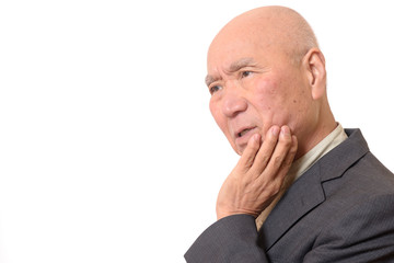 困った顔のビジネスマンシニア