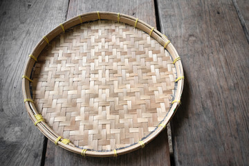 Obraz na płótnie Canvas Threshing basket on the wooden floor.