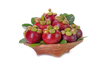 Mangosteen in Thai style basket, isolated on white background. Mangosteen, the famous exotic delicious tropical fruits from Thailand. Mangosteen also known as Queen of fruits.