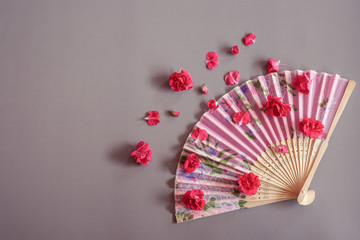 Paperfan Sprinkle with red flower, Chinese blow, Japanese fans, Wood blower, Ancient paper isolated on Gray background.