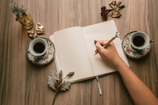 Christmas Cozy Table, Chrismas Decoration With Coffee and Tea, Mugs, Plants and Flowers, Notebook