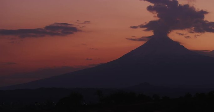 Sunset time of smoke flowing out of Popocatepetl Volcano in Puebla, Mexico. 