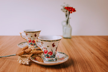 Christmas Cozy Table, Chrismas Decoration With Coffee and Tea, Mugs, Plants and Flowers, Notebook