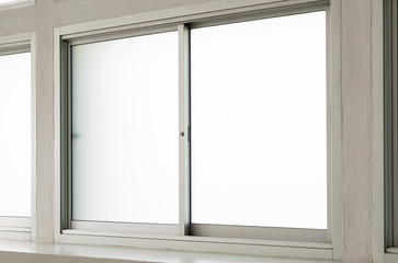 Stainless steel clear glass window view inside house, interior closed white double panes frame with light background