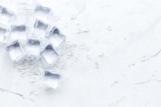 Frozen water in ice cubes on marble bar table top view mockup