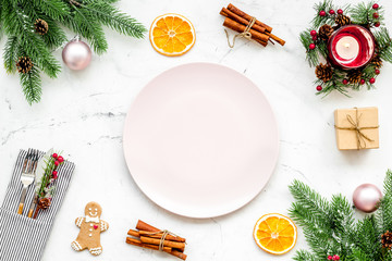 Christmas and new year celebration with gift and fir tree on white table background top view mock up