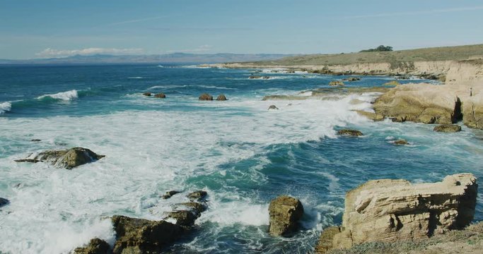 Slow motion of the rugged coastline from the bluffs at Montana de Oro State Park, California