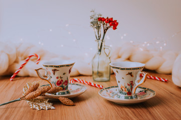 Christmas Cozy Table, Chrismas Decoration With Coffee and Tea, Mugs, Plants and Flowers, Notebook