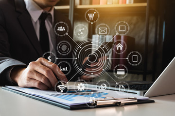 Digital marketing media in virtual screen.business working digital tablet, smartphone with keyboard and computer laptop at office in morning light