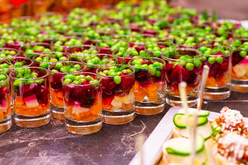 green peas in a salad dressing with vegetables on a buffet table
