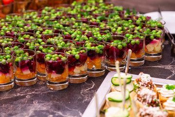 green peas in a salad dressing with vegetables on a buffet table