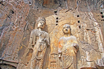 Longmen Grottoes : The Bodhisattava sculptures of Fengxian Cave (or Li Zhi Cave) The world heritage site, Chinese Buddhist art. Located in Louyang, Henan province China. Selective focus.