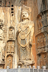 Fototapeta na wymiar Longmen Grottoe : Bodhisattava sculptures of Fengxiansi cave. The world heritage site, Chinese Buddhist art. Louyang, Henan province China. Selective focus.