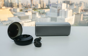 isolated wireless modern earphone with portable speaker for listening music in office