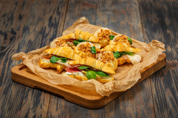 croissant with ham and greens