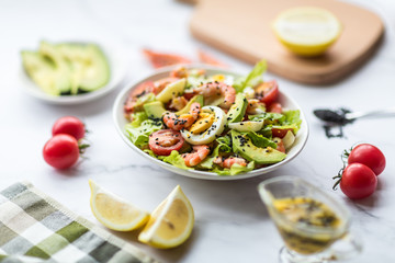 Fresh salad lying in white plate