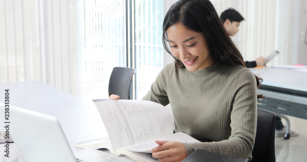 Poster asian women students smile and reading book and using notebook for helps to share ideas in the work 