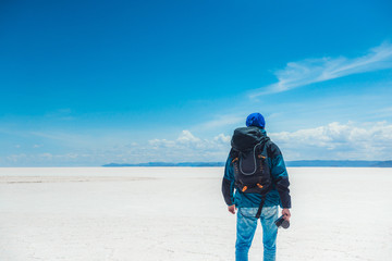 Tourist taking pleasure of Salar de Uyuni