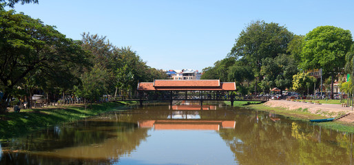 A bridge in Siem Reap  with reflections in the river, Cambodia