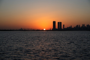 Dubai slyline from Dubai Creek Harbour and Dubai canal to Downtown and Business Bay, United Arab Emirates