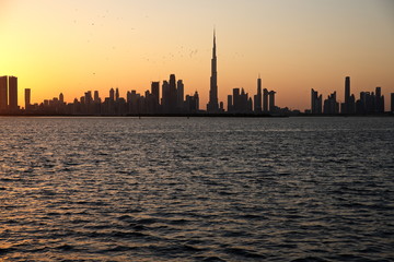 Obraz na płótnie Canvas Dubai slyline from Dubai Creek Harbour and Dubai canal to Downtown and Business Bay, United Arab Emirates