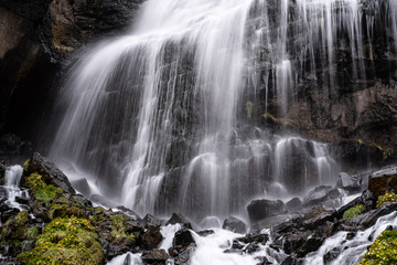 Fototapeta na wymiar picturesque waterfall. Long exposure, water jet blurred in motion