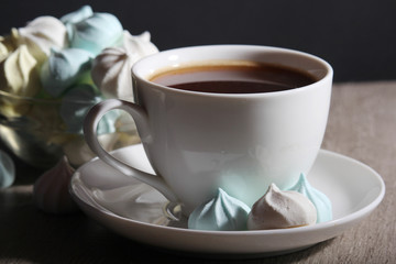 A cup of coffee and meringues for breakfast
