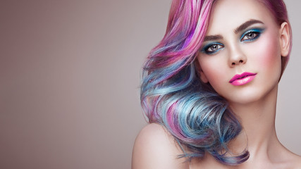 Beauty Fashion Model Girl with Colorful Dyed Hair. Girl with perfect Makeup and Hairstyle. Model...