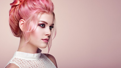Blonde Girl with Elegant and shiny Hairstyle. Beautiful Model Woman with Curly Hairstyle. Care and Beauty Hair products. Perfect Make-Up