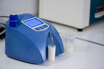 analysis and testing of dairy products on a modern device. test laboratory of a milk factory