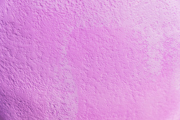 bright purple concrete background tecture lit by the sun