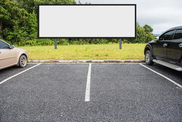 outdoor car parking and empty white billboard .Blank space for text and images.