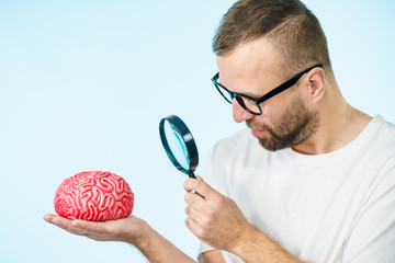 Man looking at human brain