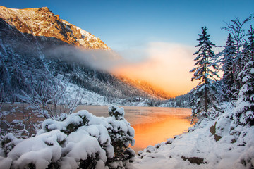 Winter nature in mountains at morning sunrise