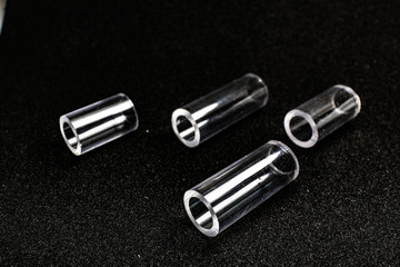 Naklejka premium transparent pipe tube on black background