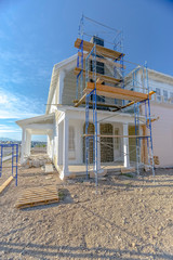 Construction of new home chimney with scaffolding