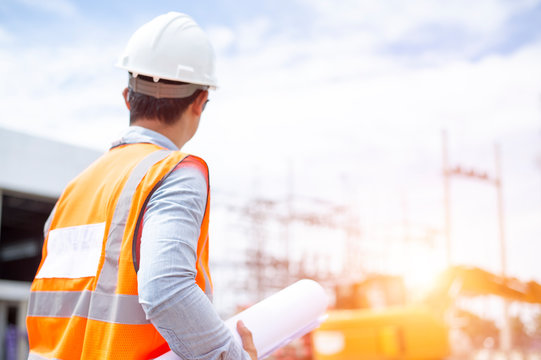 Asiatic engineers are work inspecting the electric building